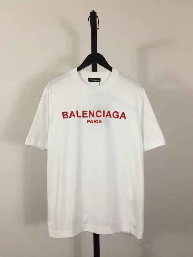 View 1 of Minimalist White Logo Tee with Bold Red Crest