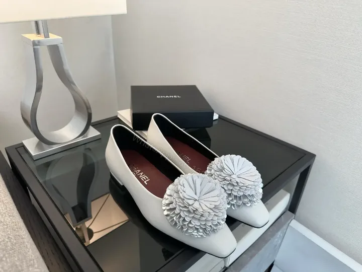 View 1 of White Leather Flats with Crochet Pom Floral—Chic Pointed-Toe Pumps