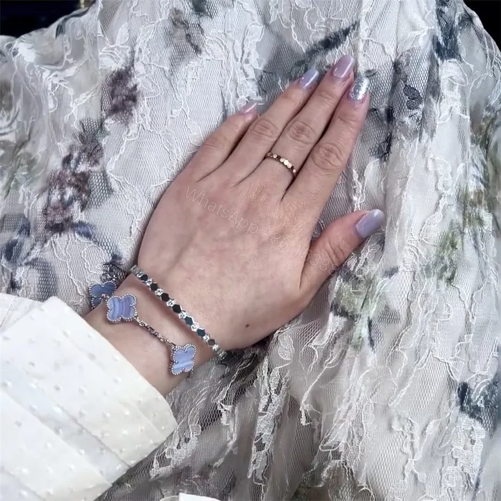 View 1 of Chaumet bee my love bracelet stack with Cartier love bracelet and Van Cleef Alhambra bracelet
