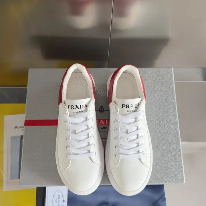 View 1 of Minimalist White-Red Leather Sneakers with Prada Touch