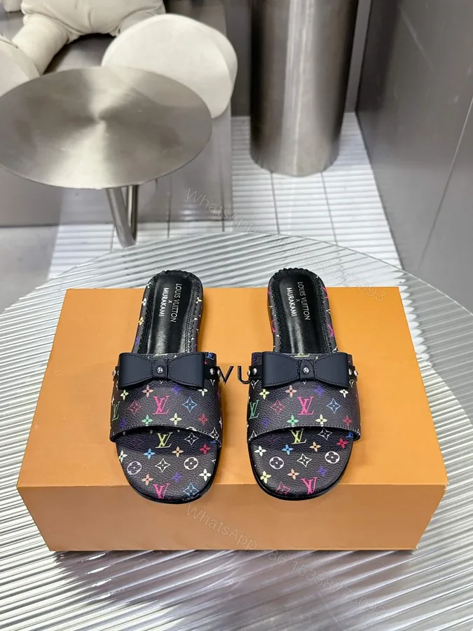 View 1 of LV Women Black Patterned Leather Bow Slide Sandals
