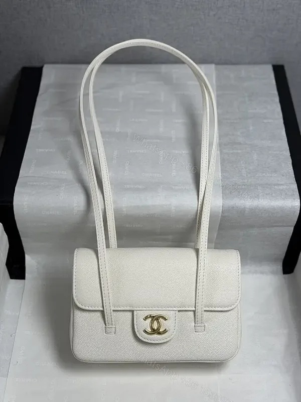 View 1 of Ivory Pebbled Calfskin Satchel: Compact Luxury Bag