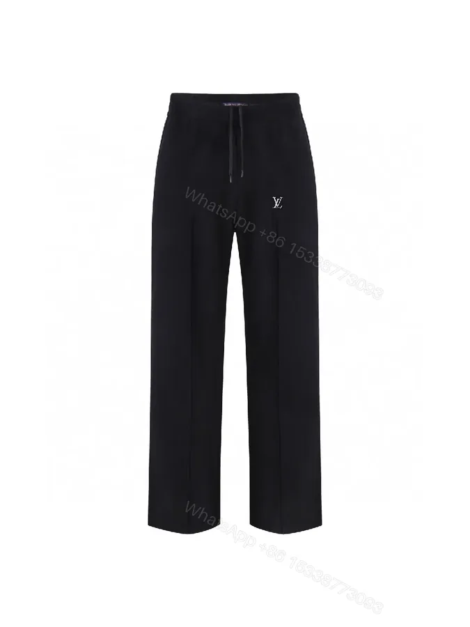 View 1 of Chic Black Wide-Leg Track Pants with Subtle Monogram Monstère