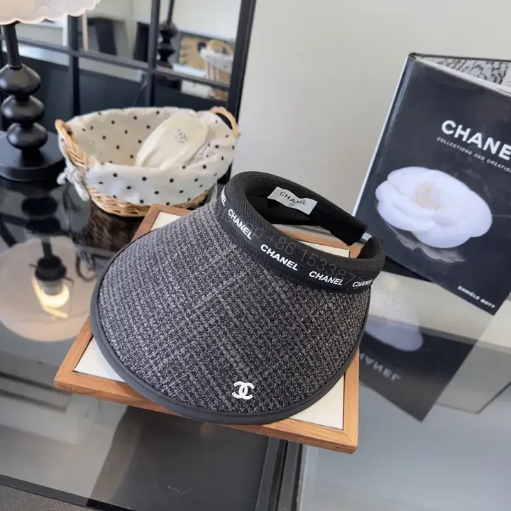 View 1 of Dark Gray Tweed Visor Cap with White Chanel Logo and Silver Emblem