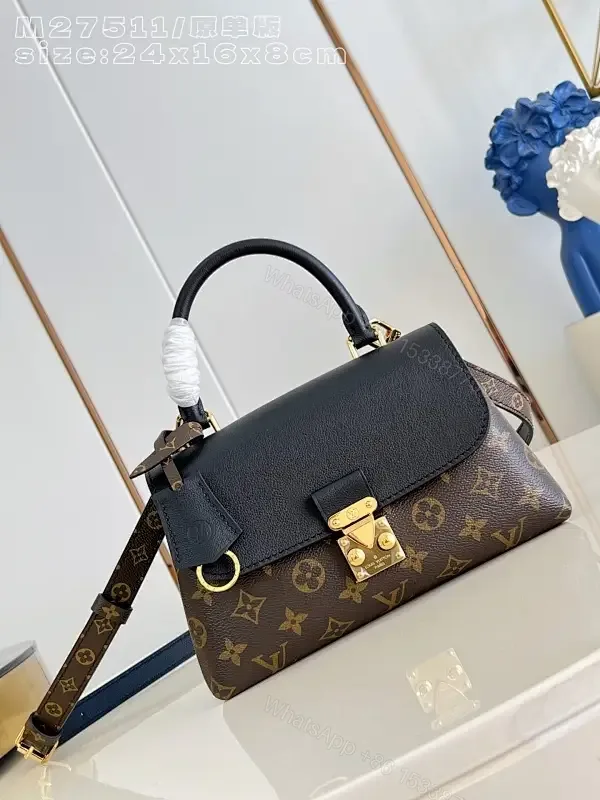 View 1 of Chic Black Satchel: Monogram Canvas, Structured Silhouette