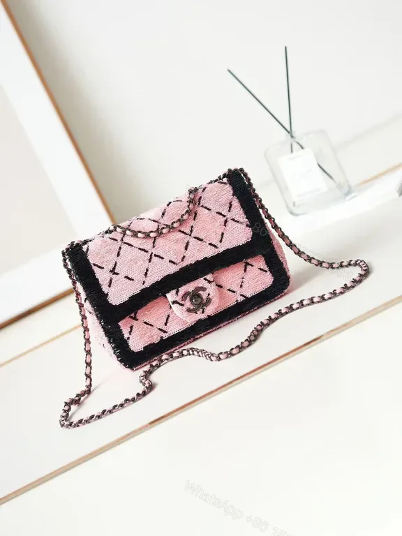 View 1 of Pink Quilted Mini Handbag with Chain Strapâ€”Chic Everyday Luxury