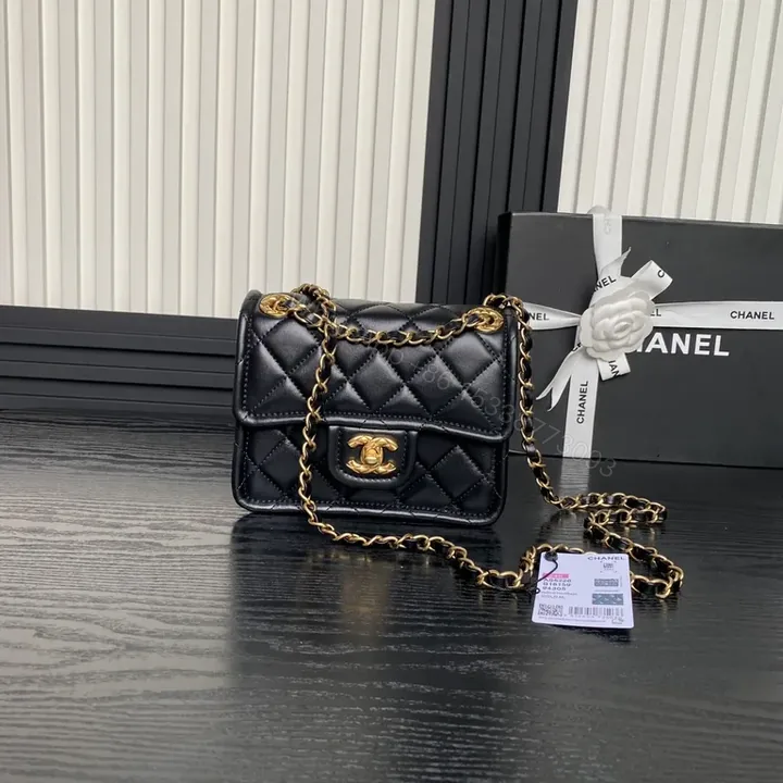 View 1 of Black Quilted Shoulder Bag with Gold Chain - Compact Luxury Bag