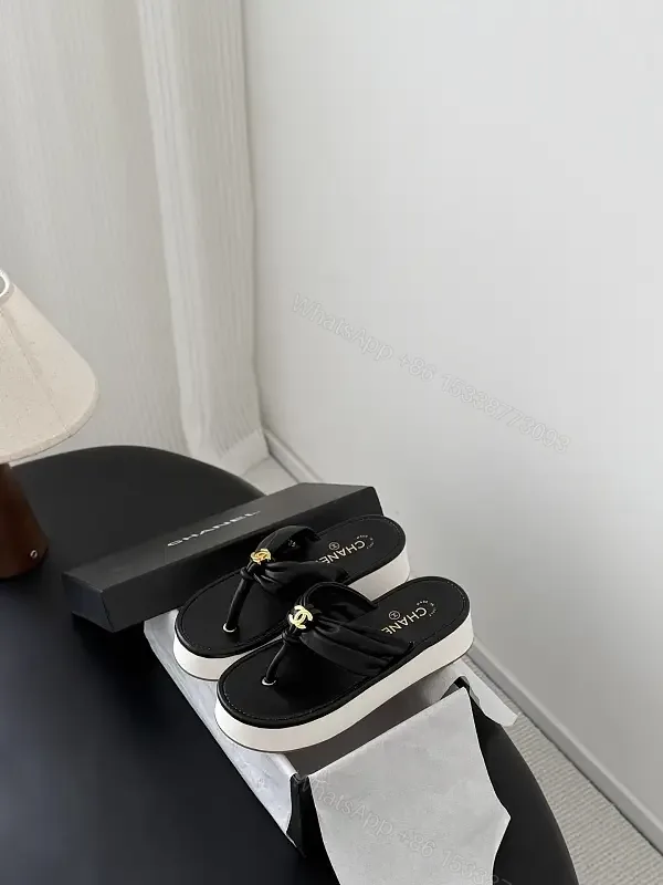 View 1 of Black Leather Slide Sandals with Gold Chanel Logo