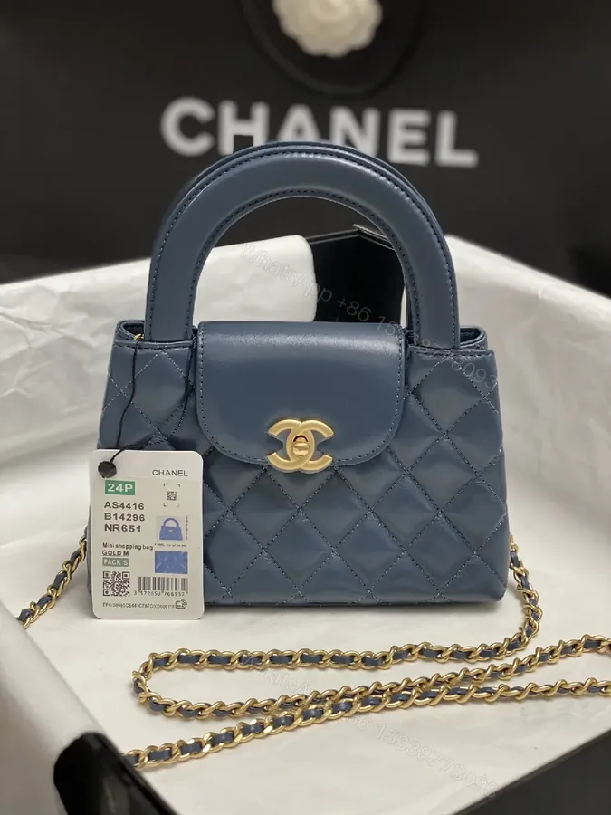View 1 of Blue Quilted Mini Bag: Structured Luxury, Gold Hardware
