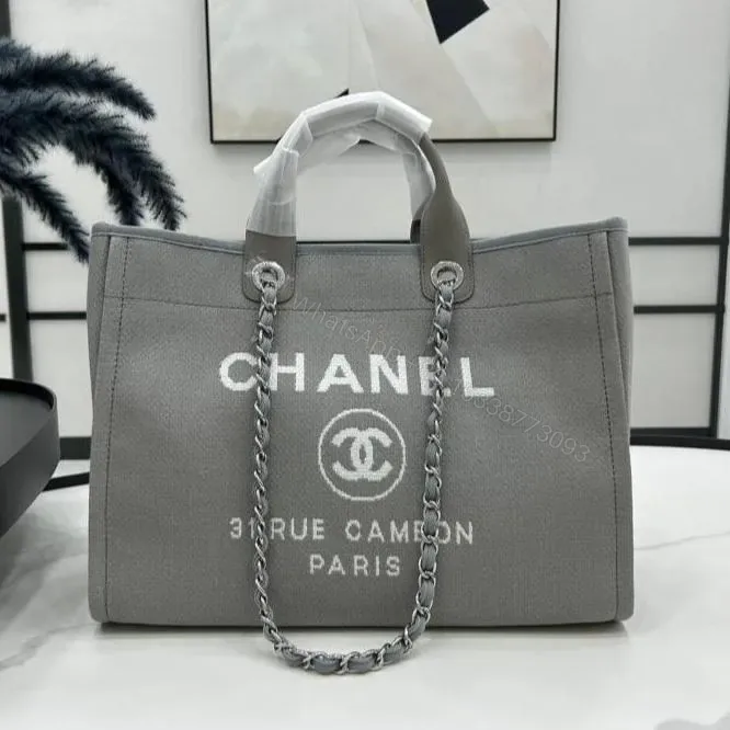View 1 of CHANEL CC DEAUVILLE LARGE 38 TOTE BAG IN GREY CANVAS WITH WHITE LOGO