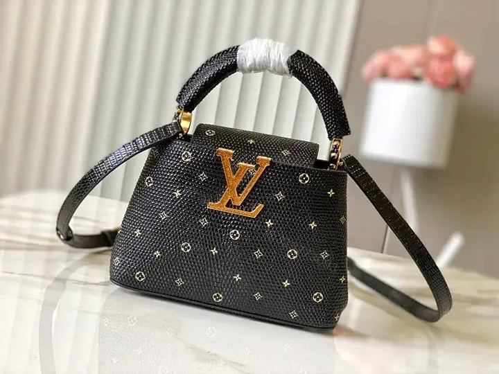View 1 of Compact Black Pebble-Grain Top-Handle Bag with Gold Hardware