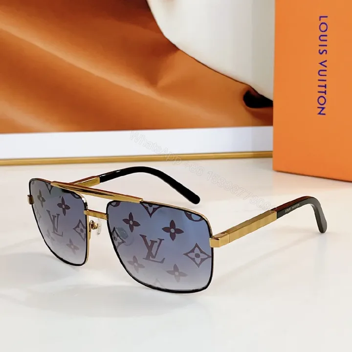 View 1 of Gold-Tone Monogram Sunglasses: Signature Luxe Statement