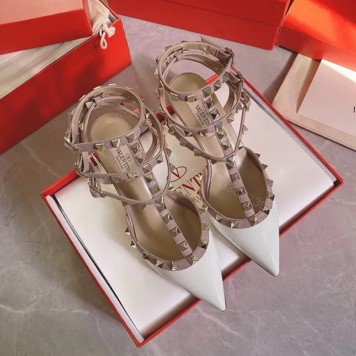 View 1 of Valentino Women White Patent Leather Rockstud Pumps