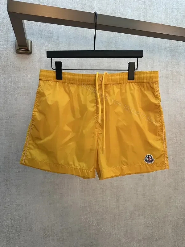 View 1 of Yellow nylon swim shorts with drawstring and logo patch for everyday luxury