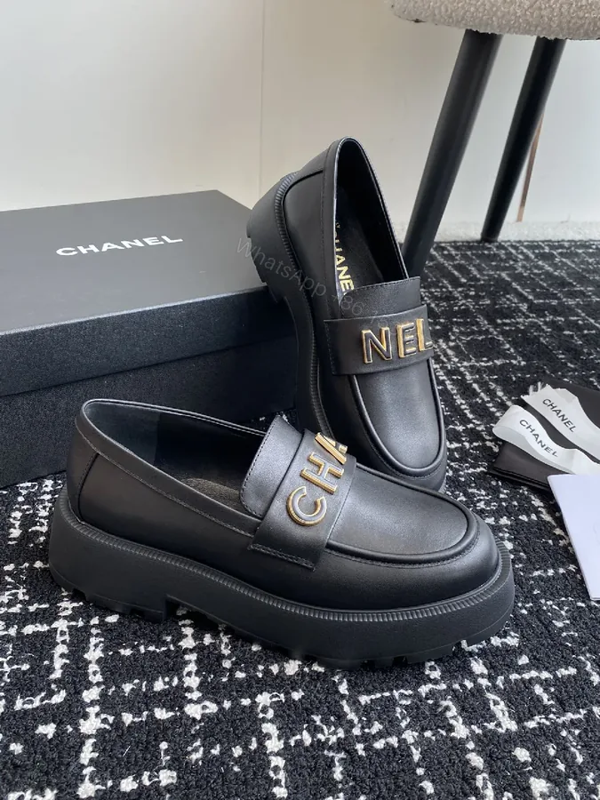 View 1 of Black Leather Loafers with Oversized Gold Logo, Luxe-Edged, Slip-On Shoes