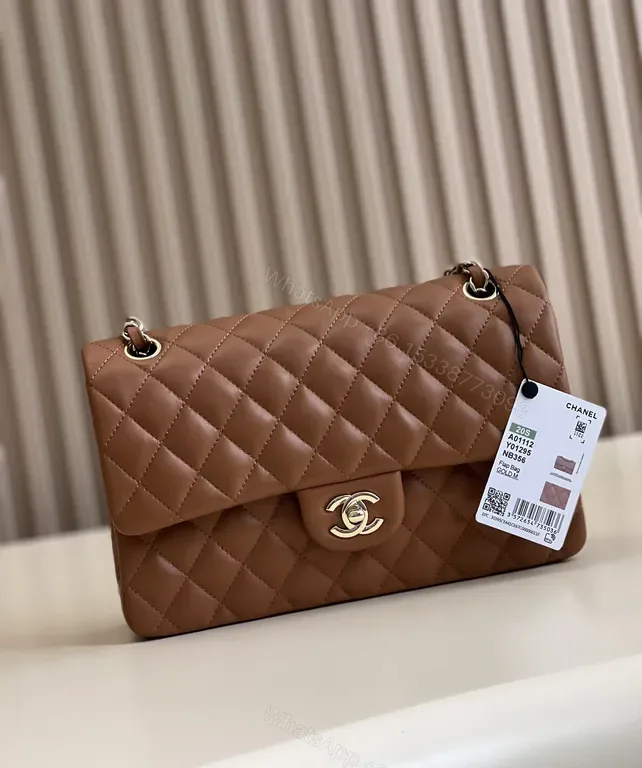 View 1 of Textured Quilted Saddle Bag with Signature Hardware - Brown Leather
