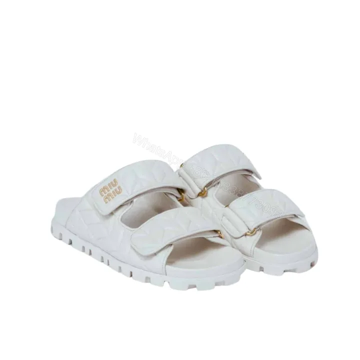 View 1 of MIUMIU MATELASSE NAPPA LEATHER SLIDES WHITE