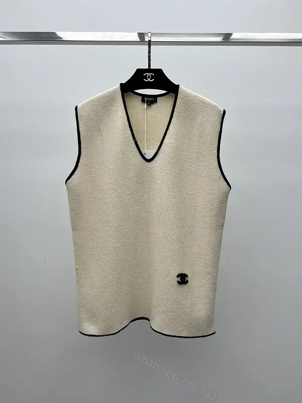 View 1 of Beige Knit Vest Black Trim V-Neck Chanel Logo Patch Tank Vest