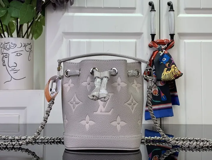View 1 of Soft-Shadow Monogram Bucket Bag: Modern Texture, Subtle Luxury