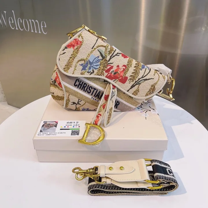 View 1 of CHRISTIAN DIOR SADDLE BAG EMBROIDERED CANVAS HANDBAG IVORY