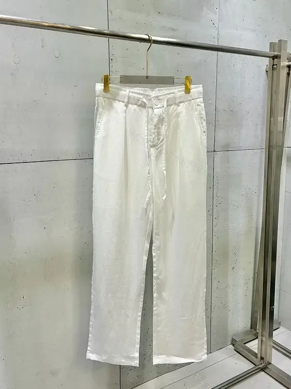 View 1 of Off-White Cream Wide-Leg Trousers with High Waist and Front Fly Closure