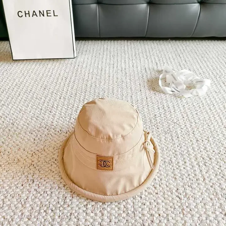 View 1 of Beige Lightweight Bucket Hat with Logo Detail