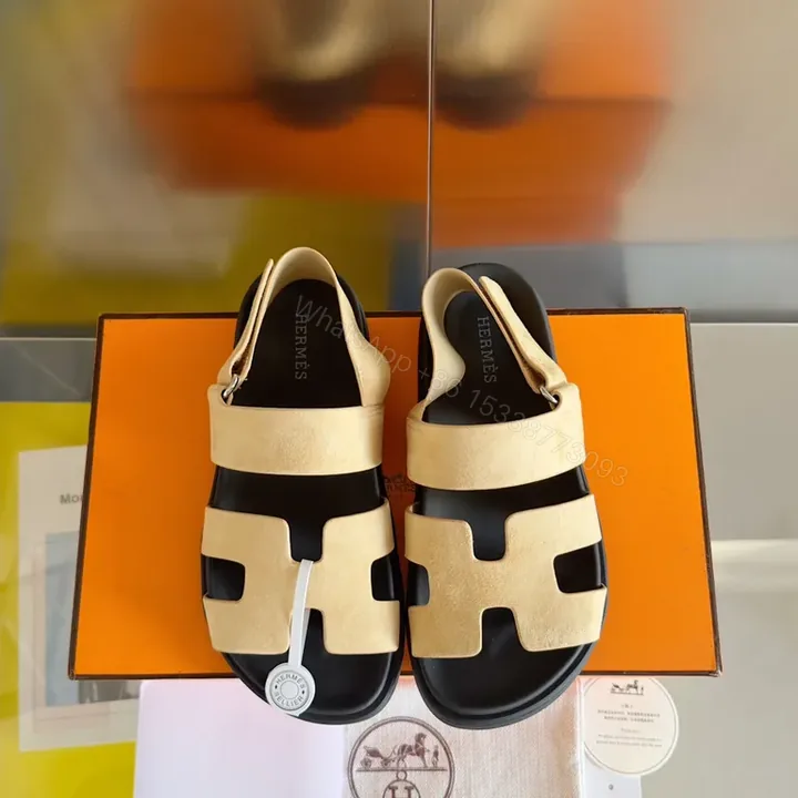 View 1 of Bold Sand & Black Hermes-Inspired Sandals: Modern Luxury Comfort