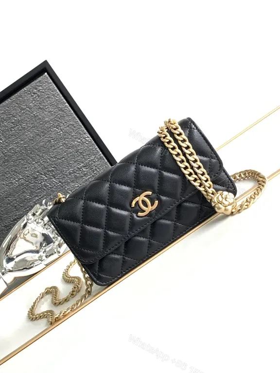 View 1 of Mini Quilted Black Chain Bag with Gold Logo â€” Luxury Silhouette