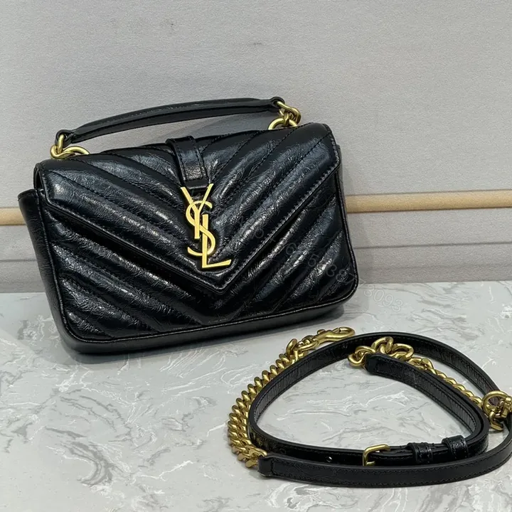 View 1 of Structured Quilted Leather Handbag with YSL Crest