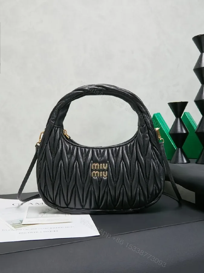 View 1 of Quilted Mini Bag: Gold-Tone Hardware, Leather, Chic Evening Luxury