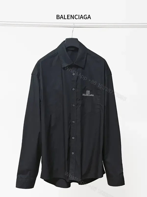 View 1 of Structured Minimalist Button-Front Shirt with Subtle Crest, Black