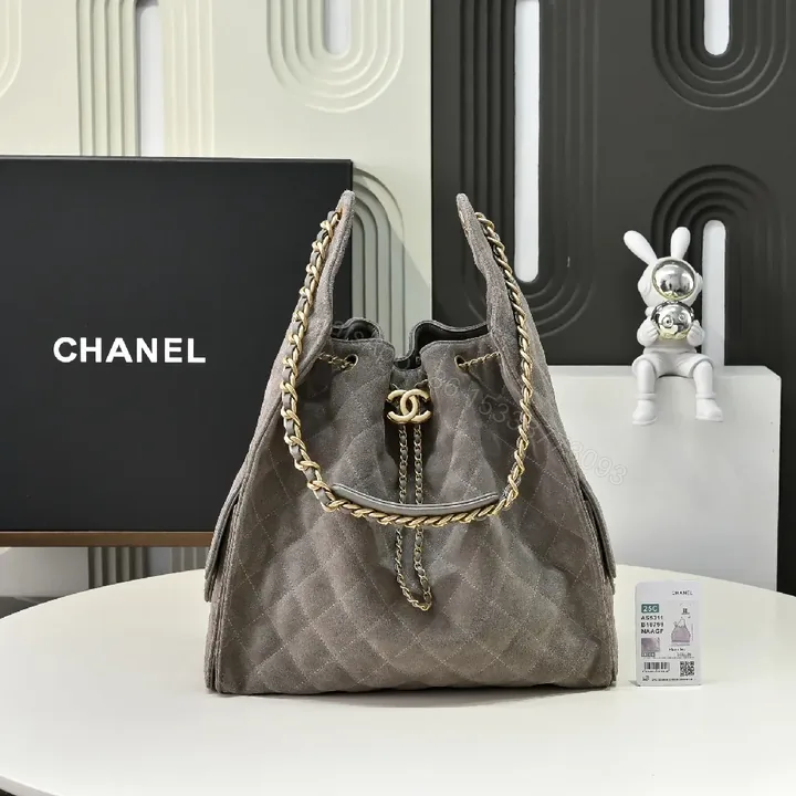 View 1 of Gray Quilted Bucket Bag with Gold Chain – Modern Texture, Everyday Versatility