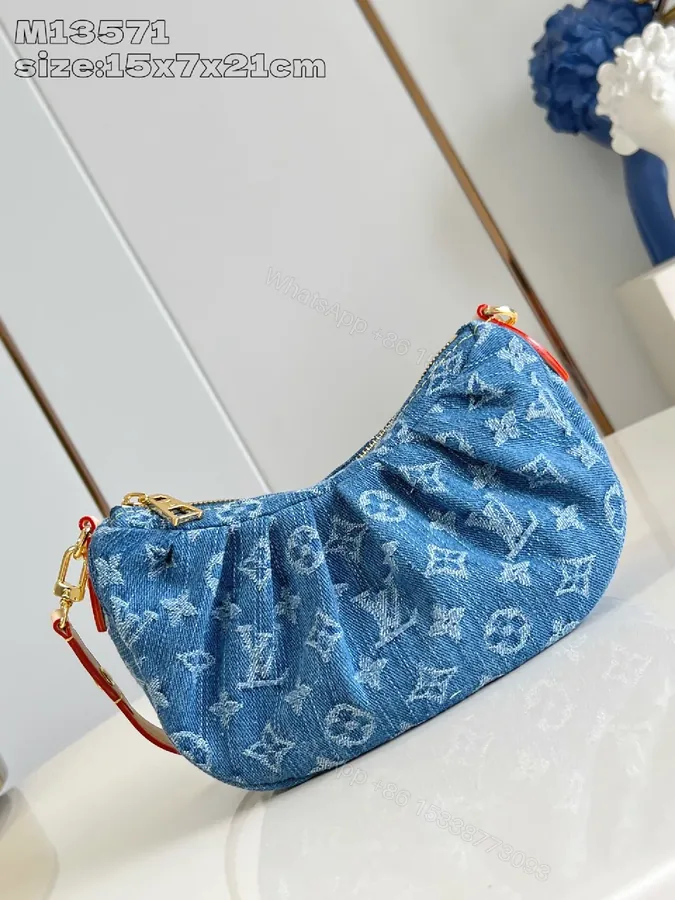 View 1 of Denim Monogram Crescent Bag: Modern, Durable, Luxury Accessory