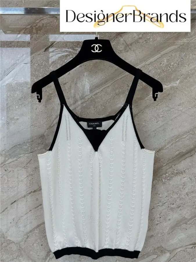 View 1 of White Knit Tank: Black Trim, Vertical Rib, Sleek Silhouette, Sleeveless Top