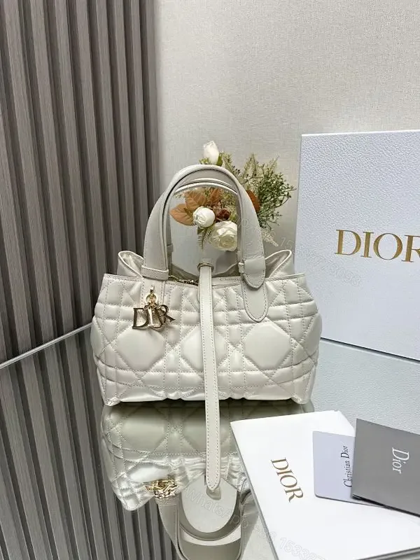 View 1 of Quilted Mini Bag - Gold Charm, Crossbody + Top Handle