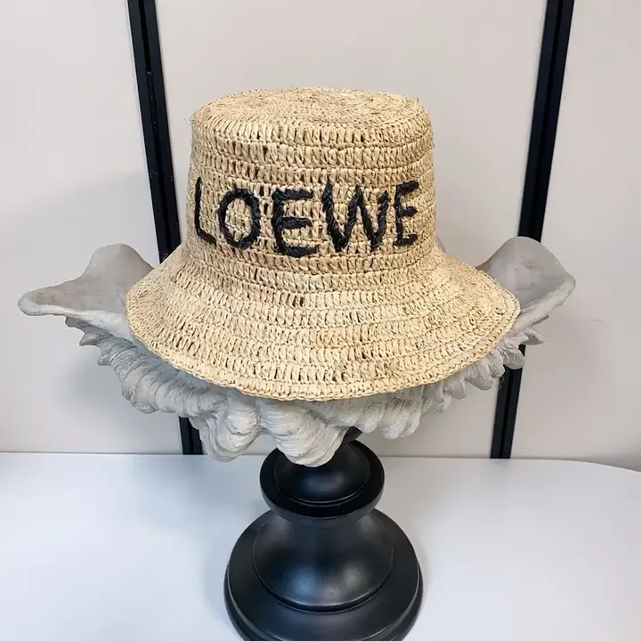 View 1 of Natural Straw Hat with LOEWE-Style Print - Lightweight, Sun-Shielding Cap
