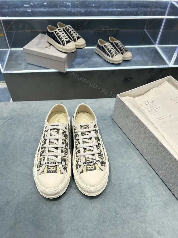 View 1 of Monochrome Textured Low-Top Sneakers with Luxe Monogram Texture