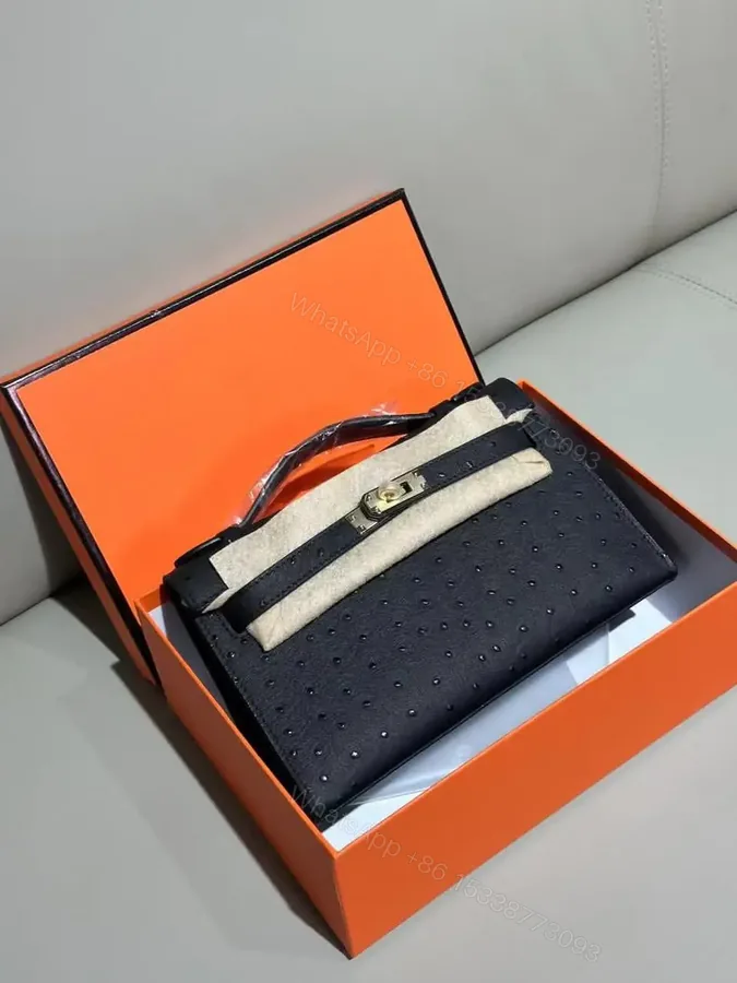 View 1 of Design Kelly Pochette Noir (Black) Ostrich Gold Hardware GHW – Dubai Fashion LUX