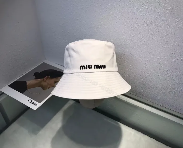 View 1 of Crisp White Miu Miu Bucket Hat: Iconic Logo Shield