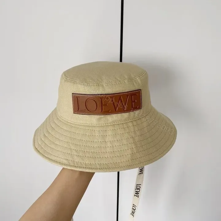 View 1 of Beige Cotton Bucket Hat with LOEWE Patch - Luxury Streetwear