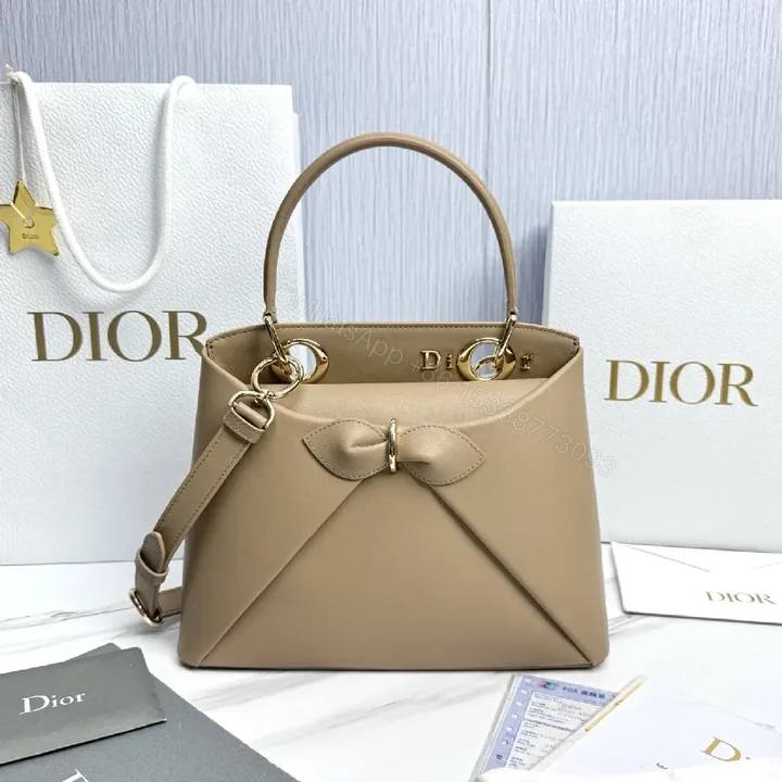 View 1 of Geometric Leather Mini Bag: Chic Bow Accent, Gold Hardware
