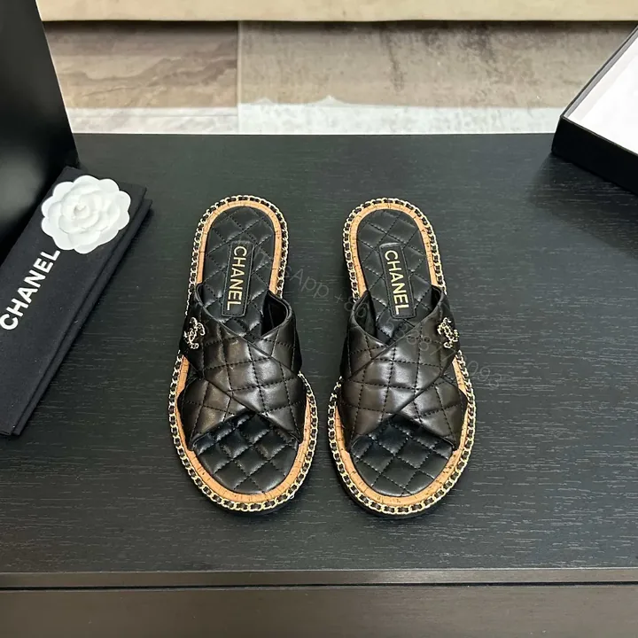 View 1 of Black Quilted Slip-Ons with Chain Trim: Elevated Comfort