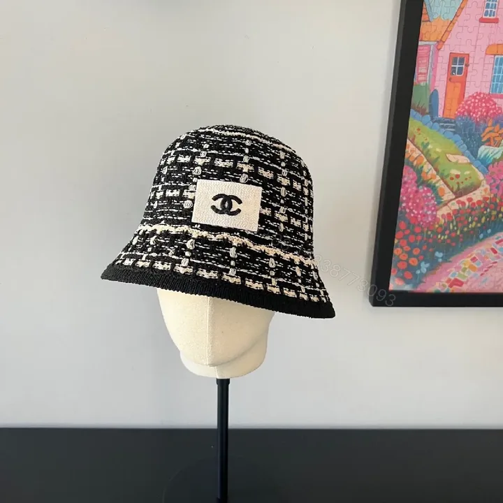 View 1 of Textured Black Bucket Hat | Tweed-Style Knit, Logo Patch, Classic