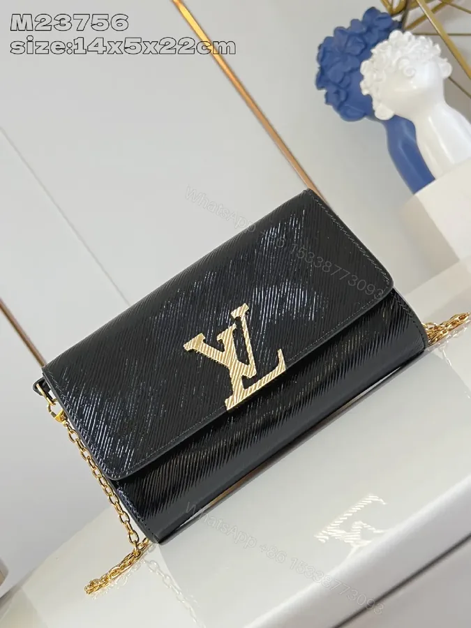 View 1 of Chic Black Lambskin Wallet Clutch with Gold Crest