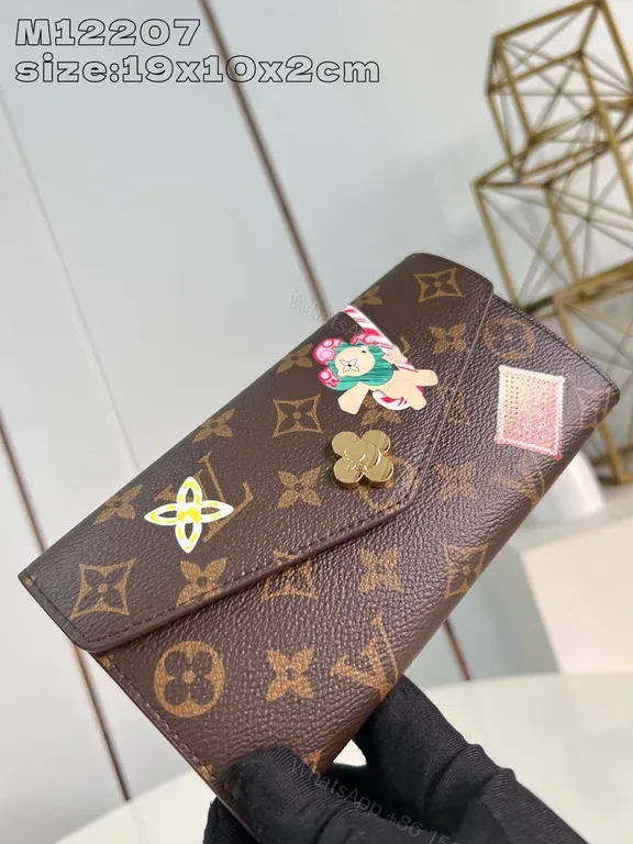 View 1 of Compact Monogram Wallet: Luxe Accent, Durable Canvas, Snap Closure