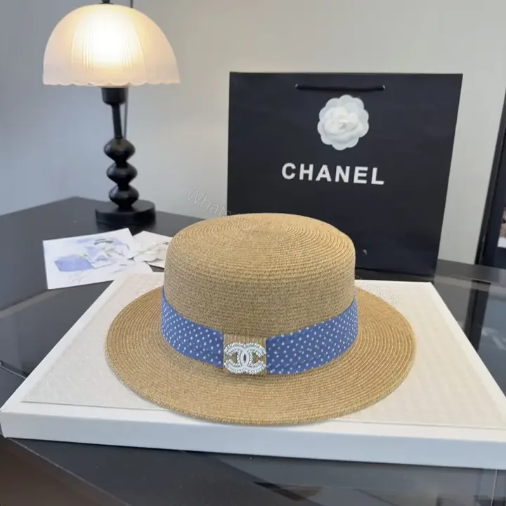 View 1 of Natural Tan Straw Boater Hat with Blue Polka Dot Band and Chanel Clasp