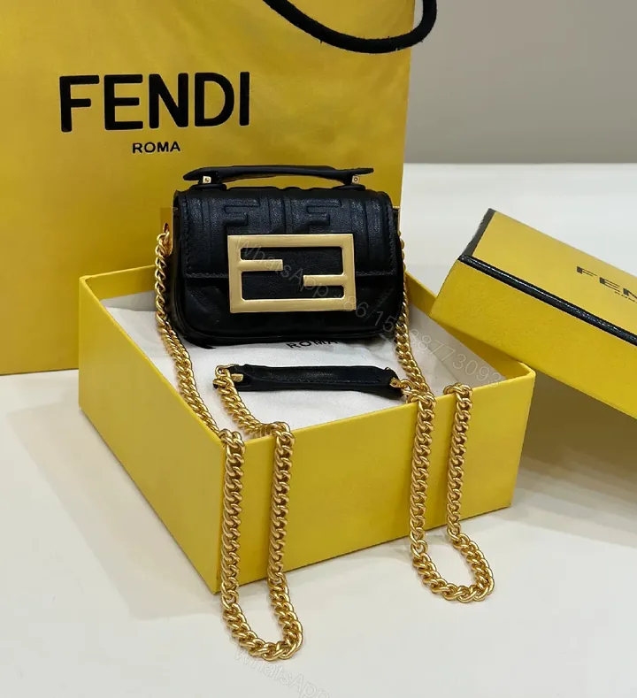 View 1 of Compact Leather Crossbody: Textured Luxury with Gold Chain Strap
