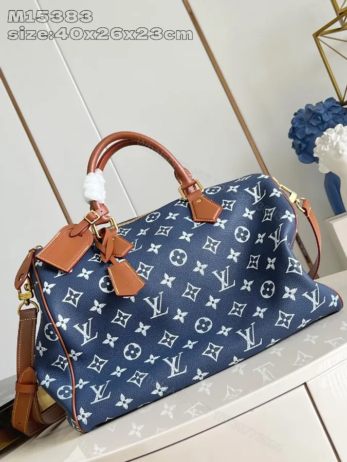 View 1 of Structured Luxe Carryall: Navy Monogram Tote with Cognac Leather