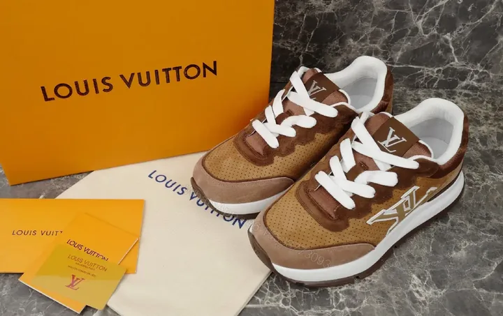 View 1 of Brown Leather Sneaker with LV Detailing - High-Top Comfort