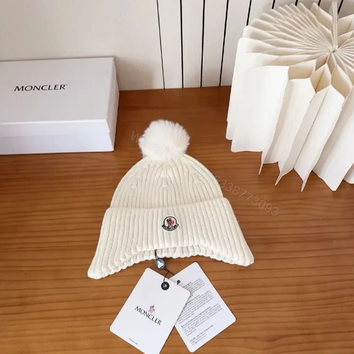 View 1 of Cozy White Knit Beanie with Pom Pom – Luxe Casual Style